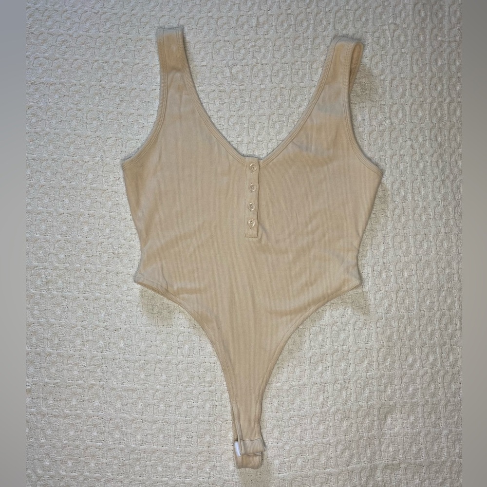 Cream color Bodysuit, brand new never worn.